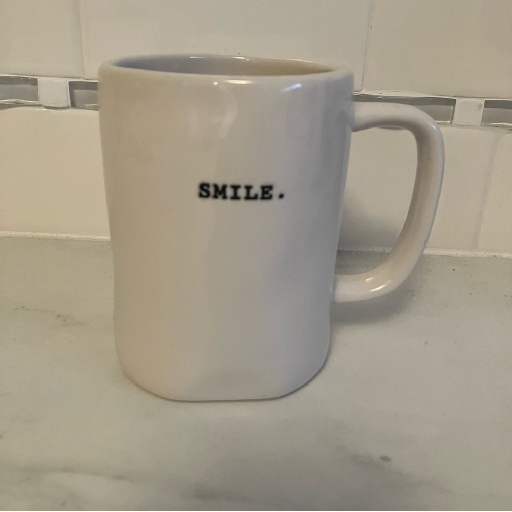 Rae Dunn white mug with smile print. Artisan collection.